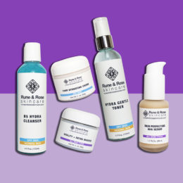 5 skincare products from the full size Essentials Kit for Anti-aging by rune and rose skincare on a dark and light purple background