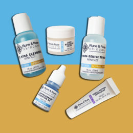 5 skincare products from the full size Essentials Kit for Normal and Dry Skin by rune and rose skincare on a blue and orange background